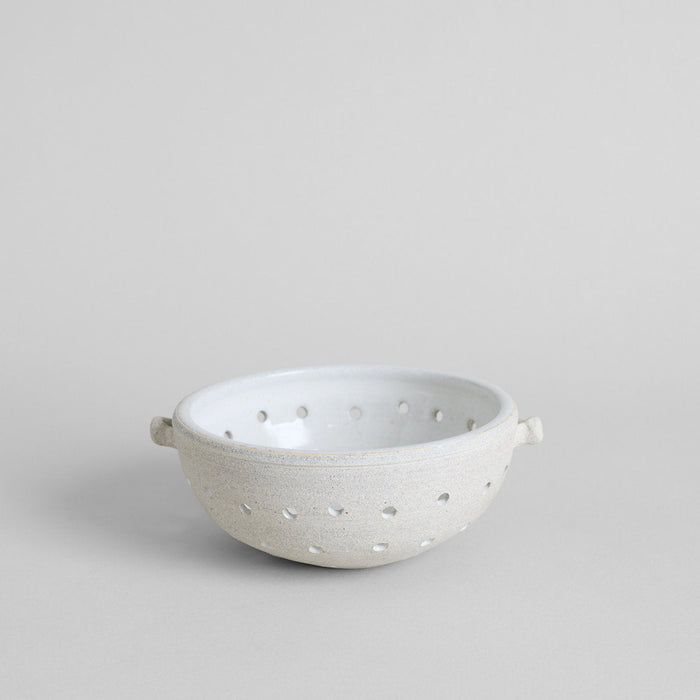 Vermont white ceramic colander with glazed interior and hand-perforated holes