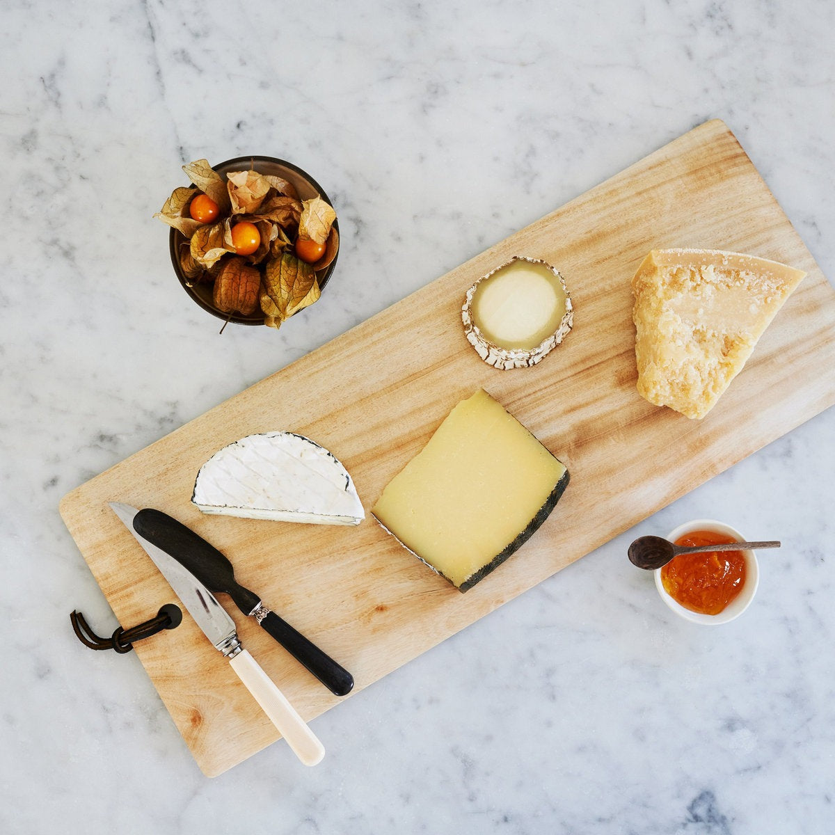 Indoor Outdoor Entertaining Essentials with wood cheese board for gatherings charcuterie