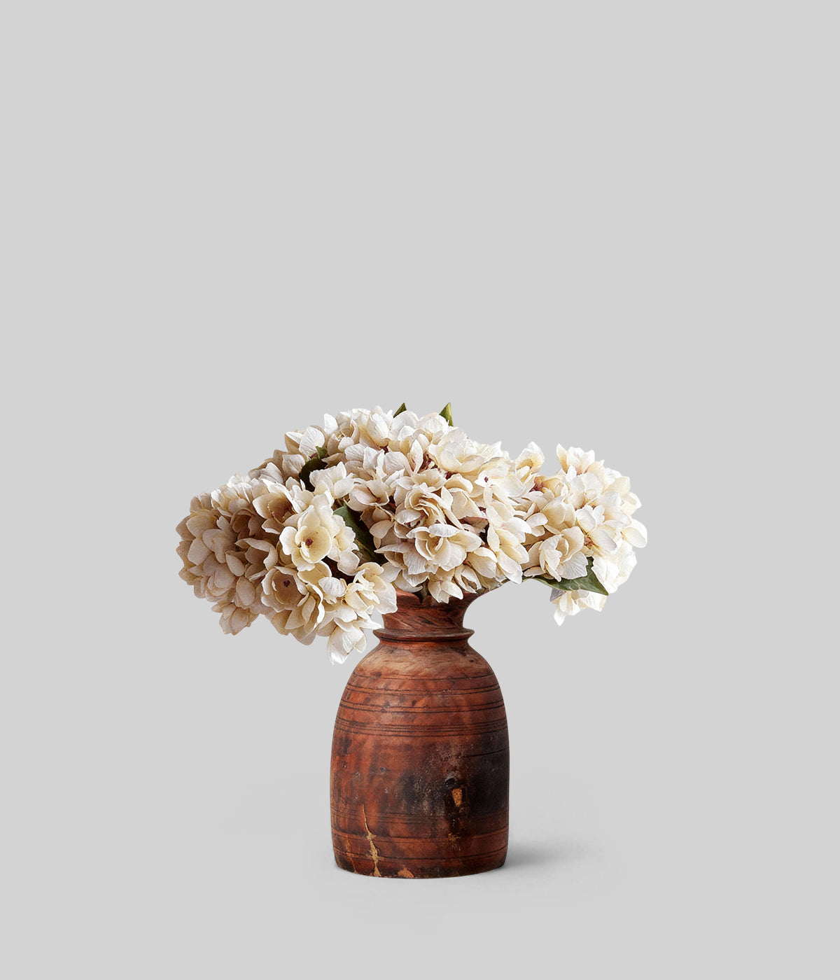 Handcrafted artificial hydrangea stems with subtle layered petal textures