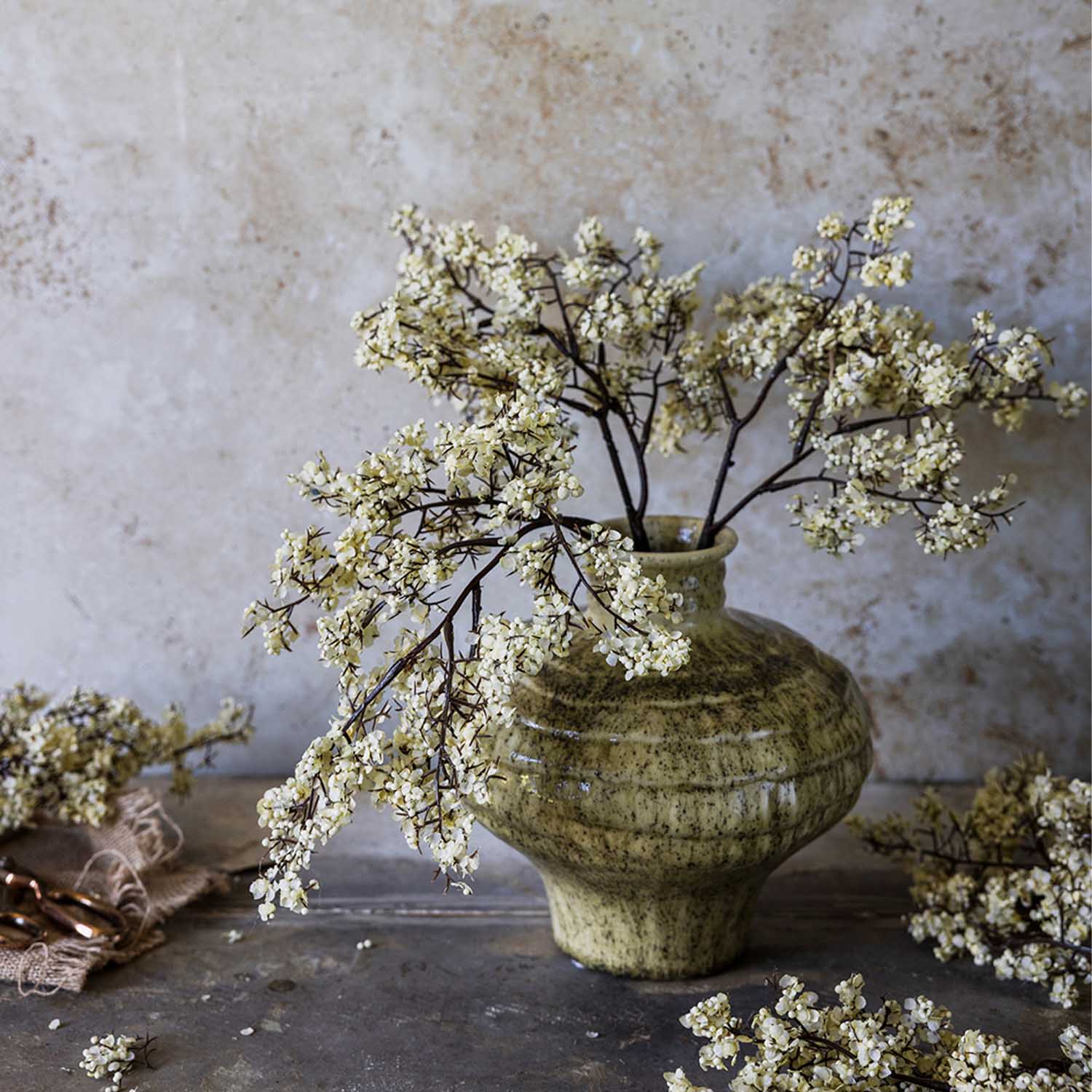 Artificial Sedge, Winter Dew featuring fine dark branching stems and delicate cream blossoms on a faux botanical stem. 