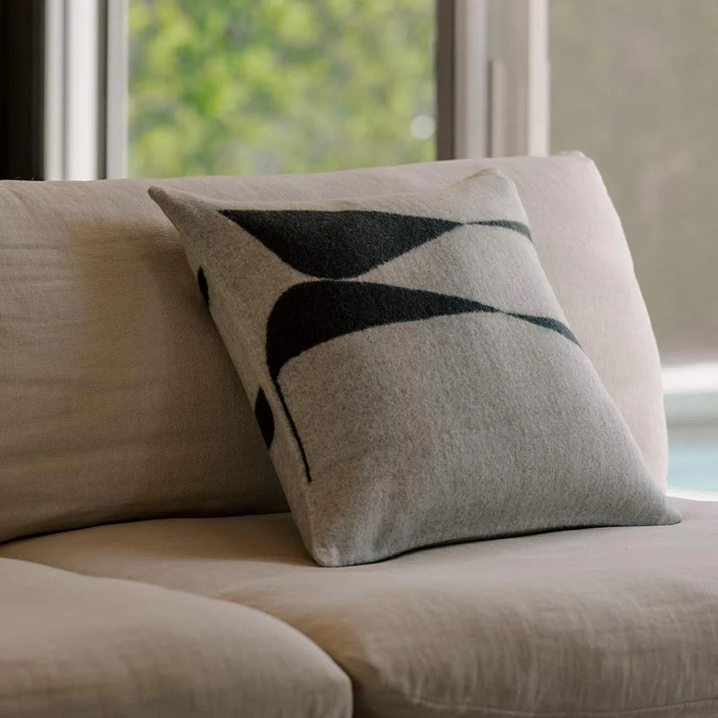 Berlin alpaca throw pillow with two opposing geometric forms woven into the fiber