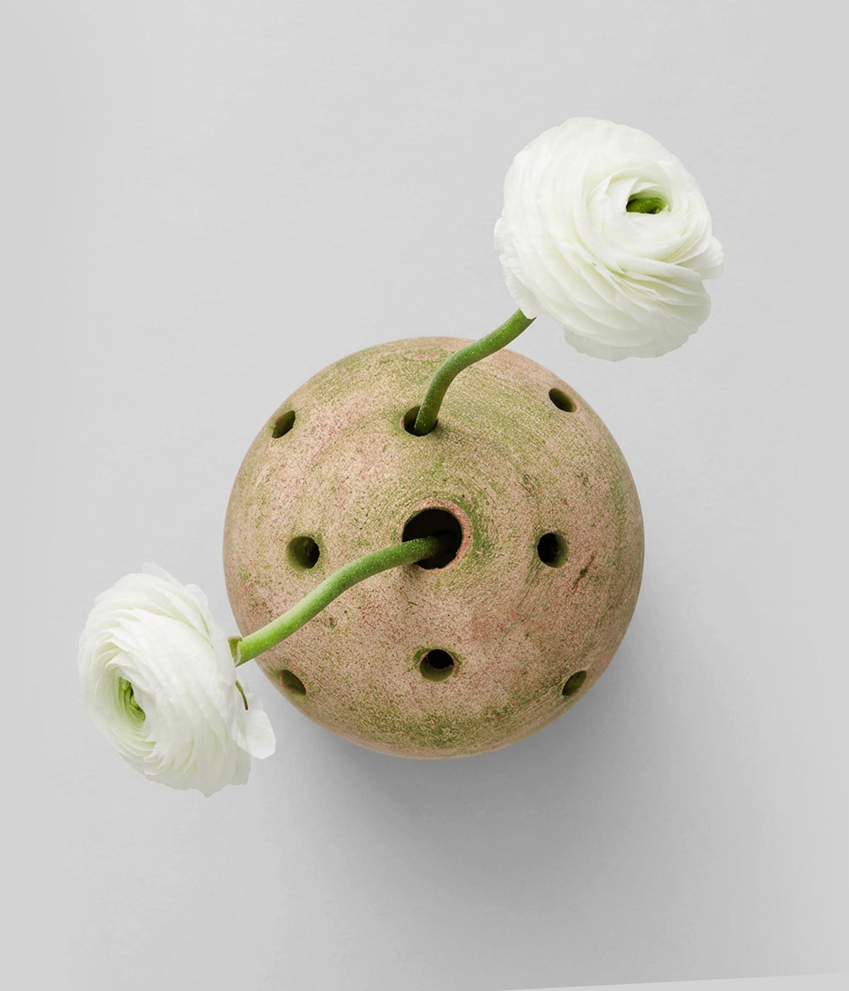 Hand-shaped terra cotta flower frog with natural tonal variation