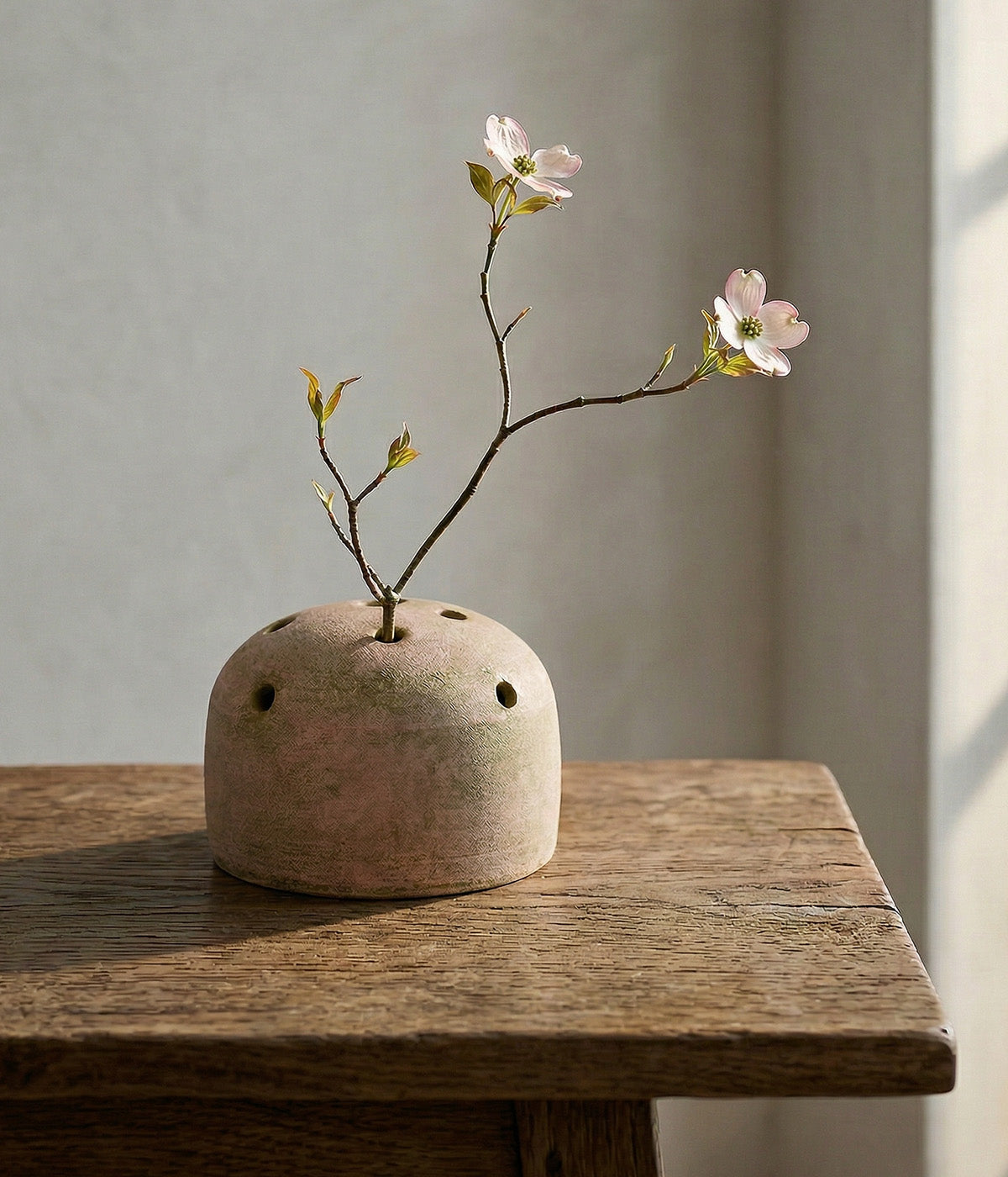 Handmade terra cotta flower frog vase with greenwashed finish