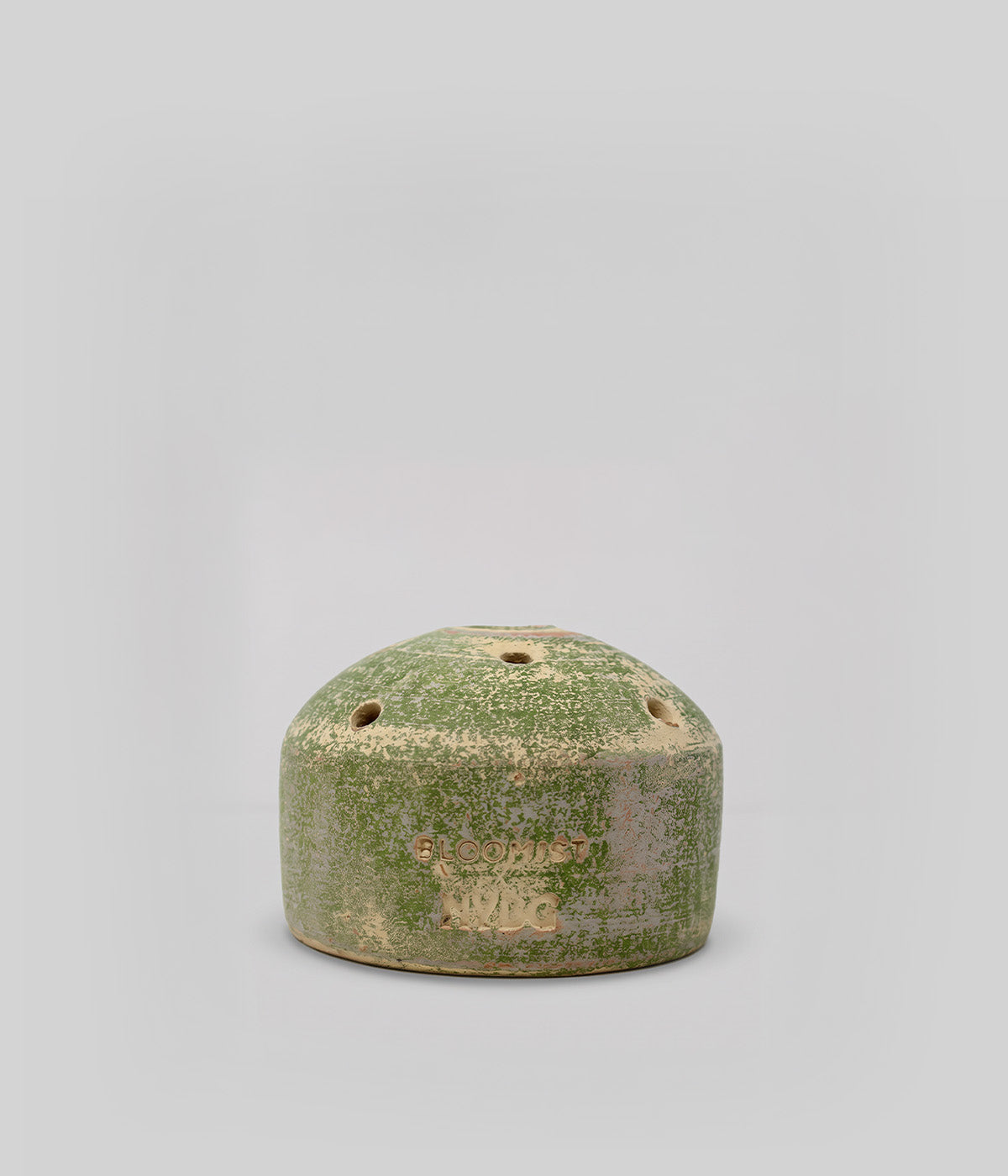Bloomist x NYBG Garden Sage terracotta flower frog vase with low domed form, integrated stem openings, and impressed branding