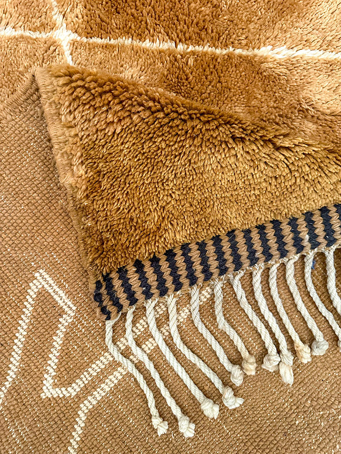 Traditional Amazigh hand-knotted wool rug made with live sheep’s wool