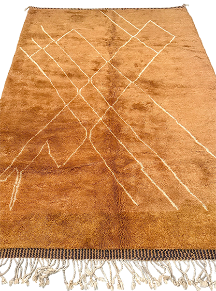 Medium to high hand-knotted wool rug with soft camel tones