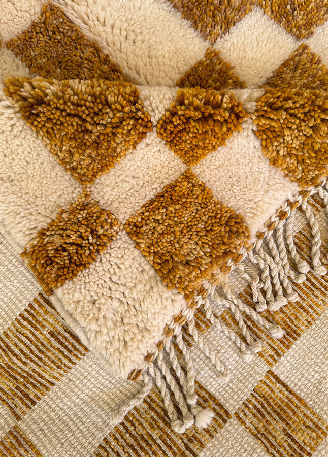 Gold and ivory rug with subtle check pattern and medium pile for bedrooms or living spaces