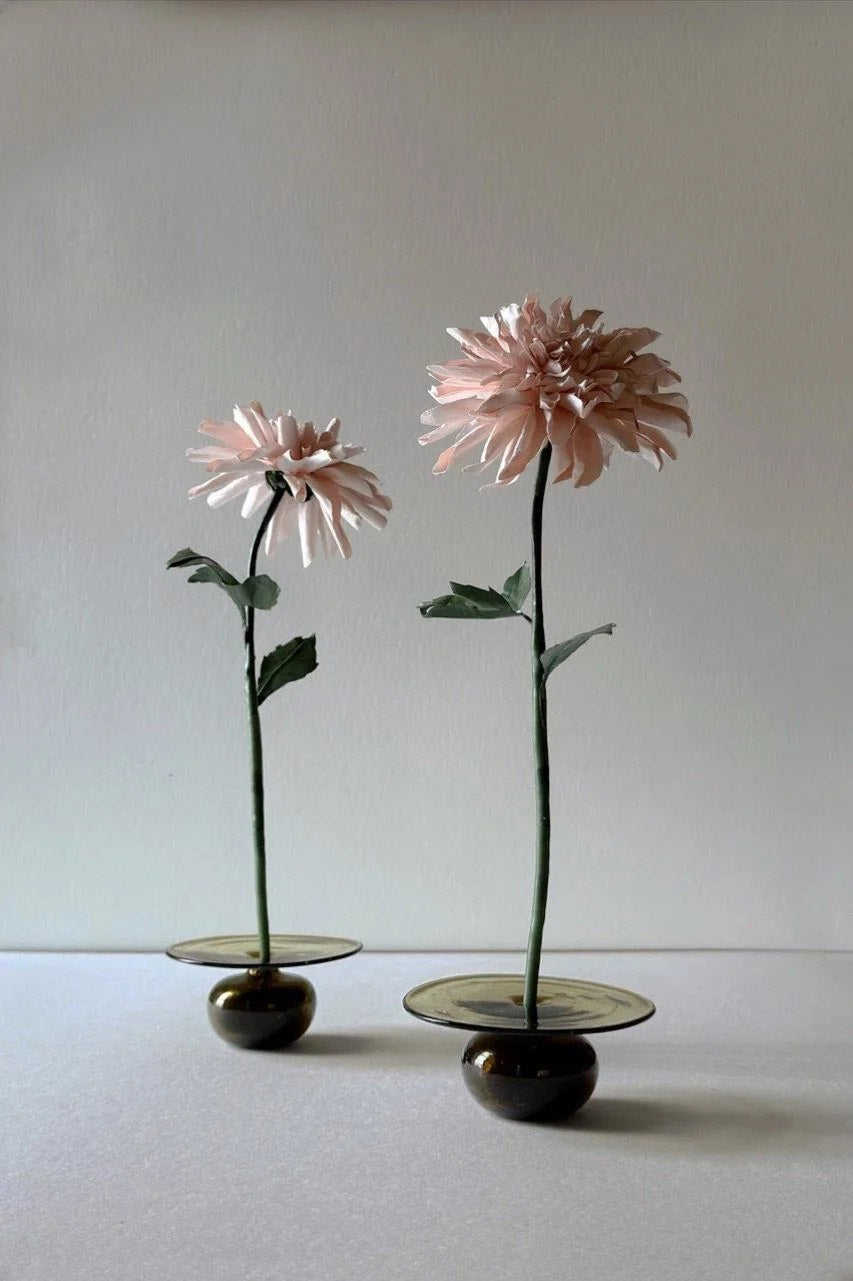Two beeswax paper chrysanthemum flowers displayed in glass bases