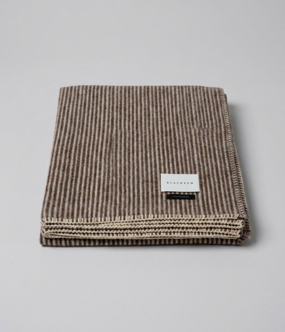 Cortez reversible throw rolled hem with blanket stitching perimeter detail