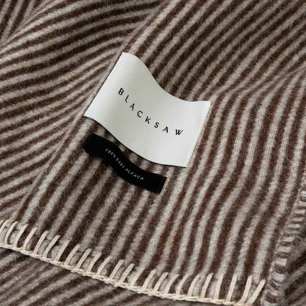 Cortez throw coffee face showing pale ivory micro stripes on coffee ground