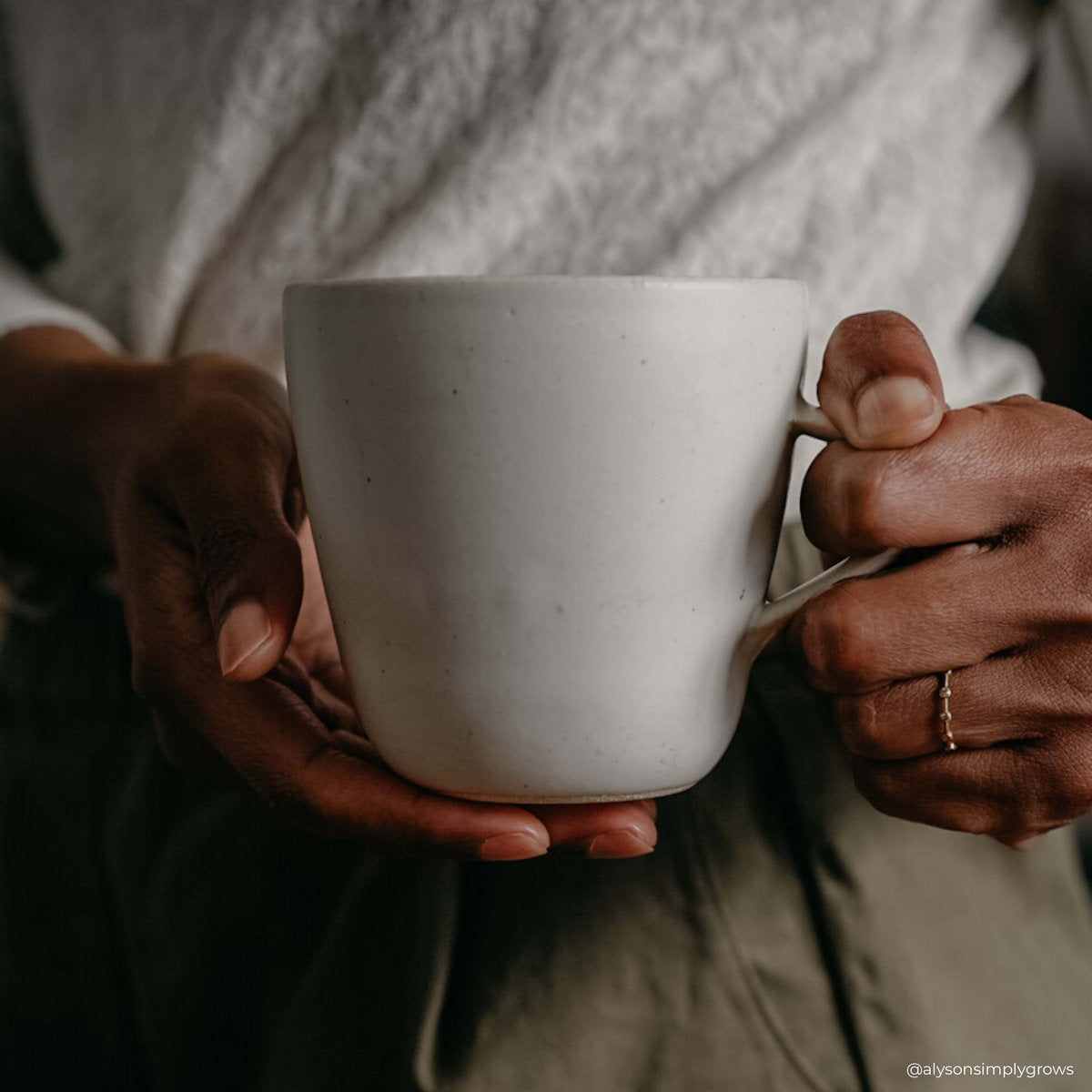 Wheel-thrown ceramic coffee cup fired at high temperature