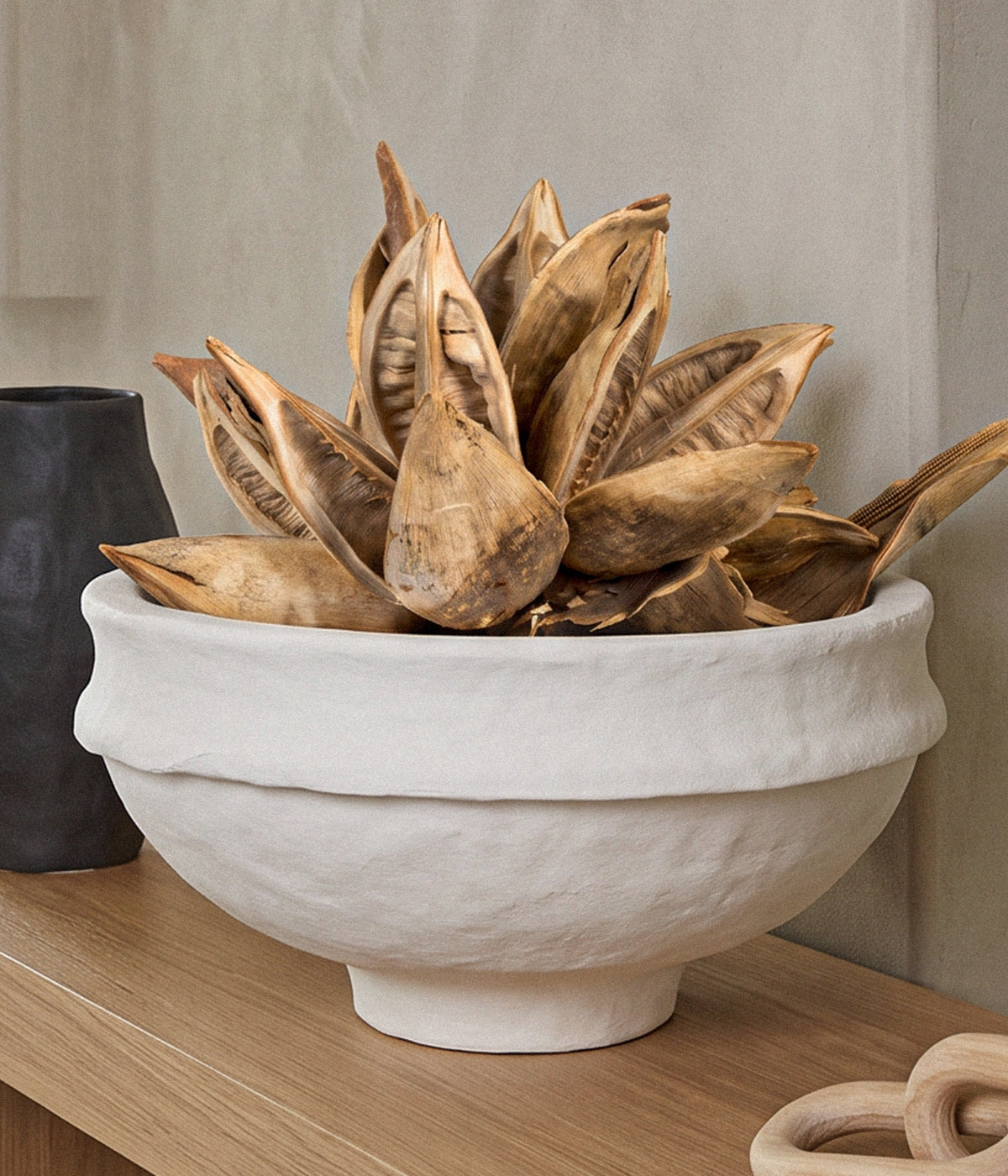 Dried Bleached Star Pod with layered open seed pods in a pale bleached finish against a white background.
