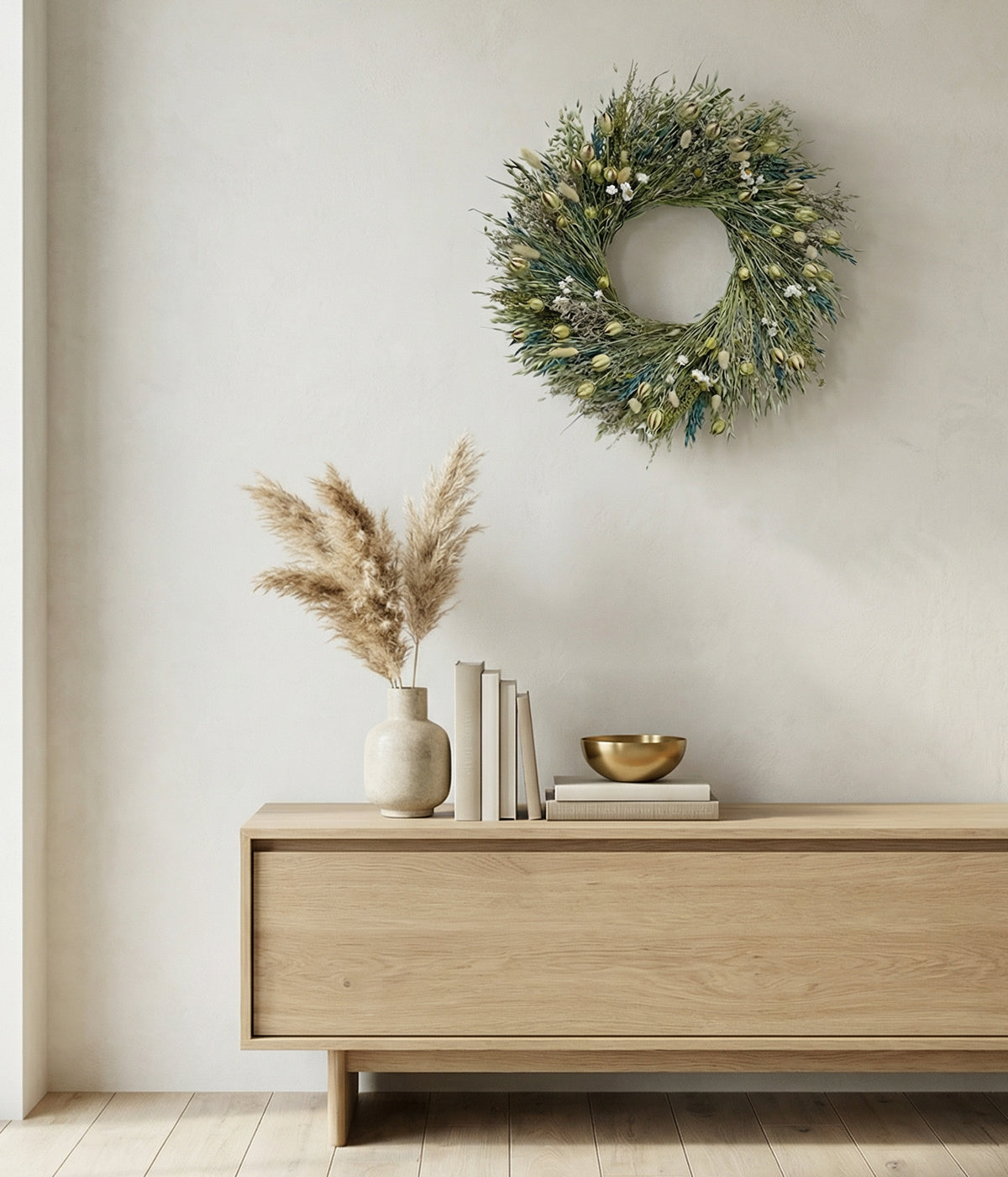 Celeste spring floral wreaths displayed on neutral wall above wooden console