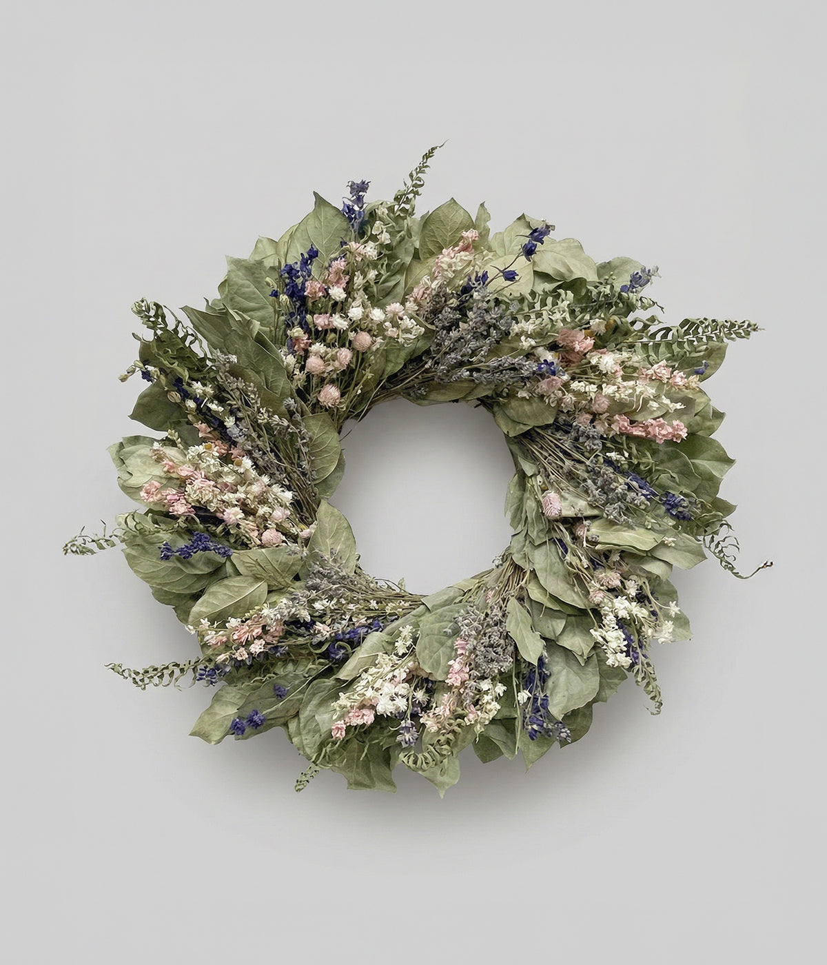 Colette dried flower spring wreath made with salal leaves, larkspur, lavender, and ammobium