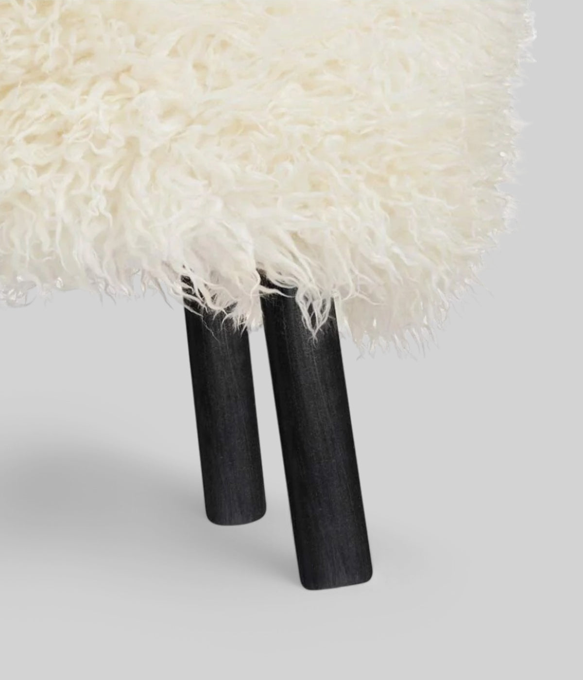 Emil foot rest stool long wool black