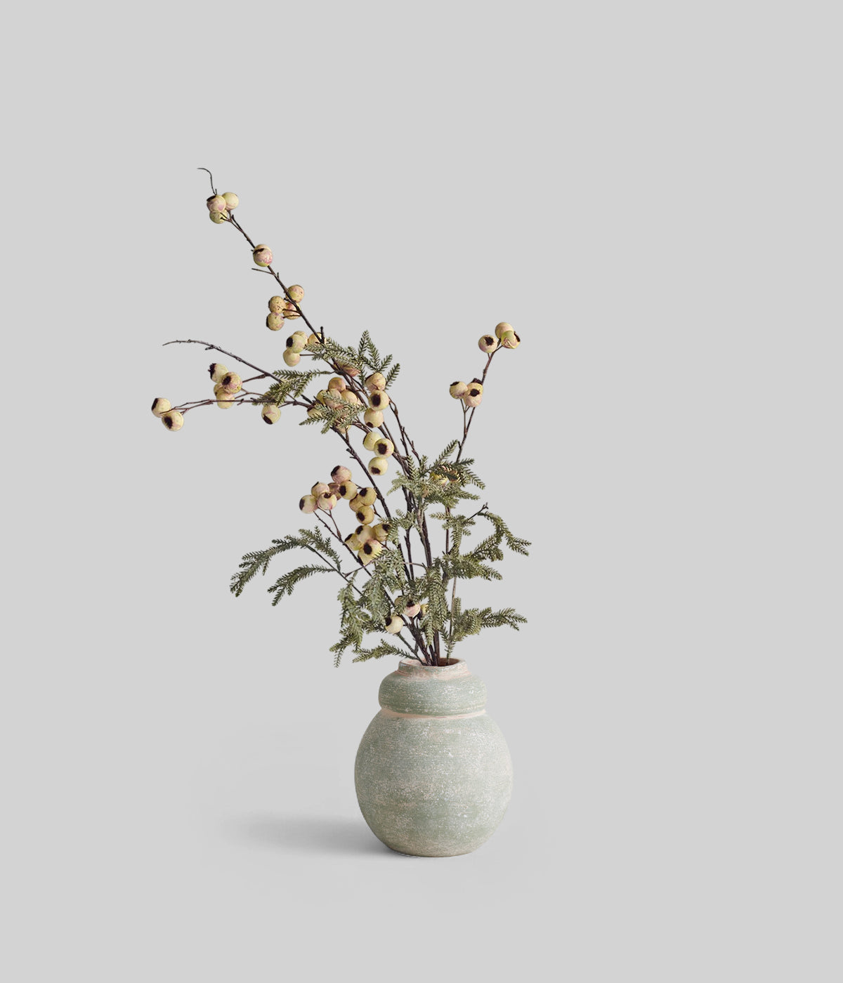 Eveline Artificial Bouquet styled in white ceramic pitcher for winter table decor