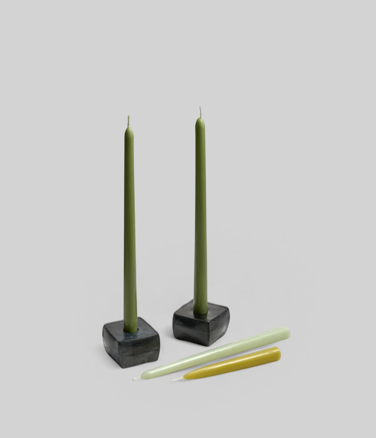 Table setting featuring 6 inch red taper candles alongside beeswax tapers