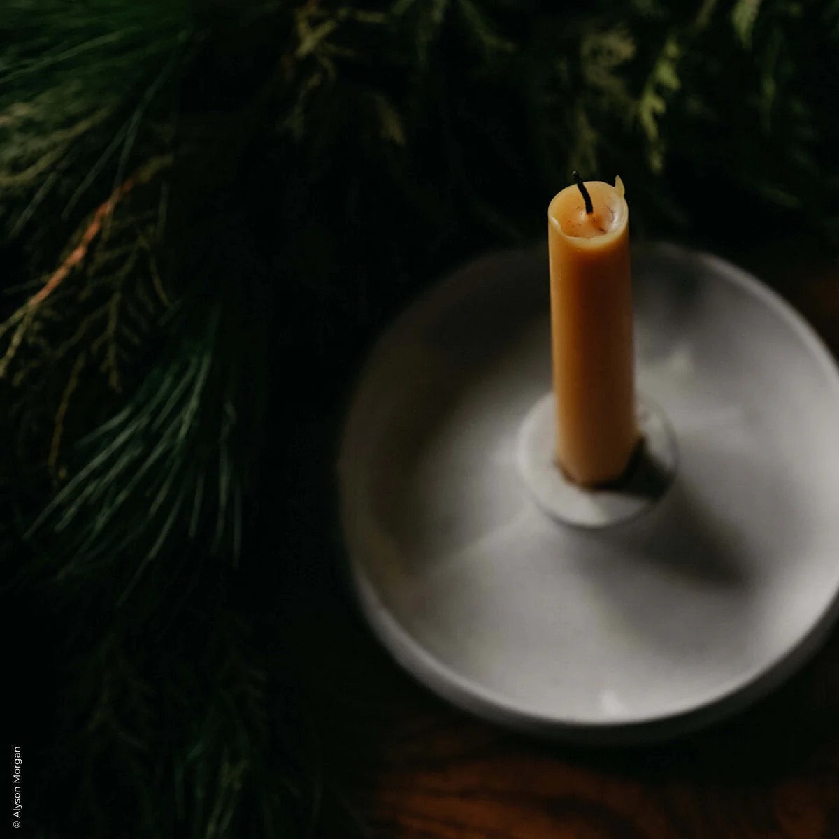 Sustainable candle set made from dark clay and pure beeswax for warm modern interiors