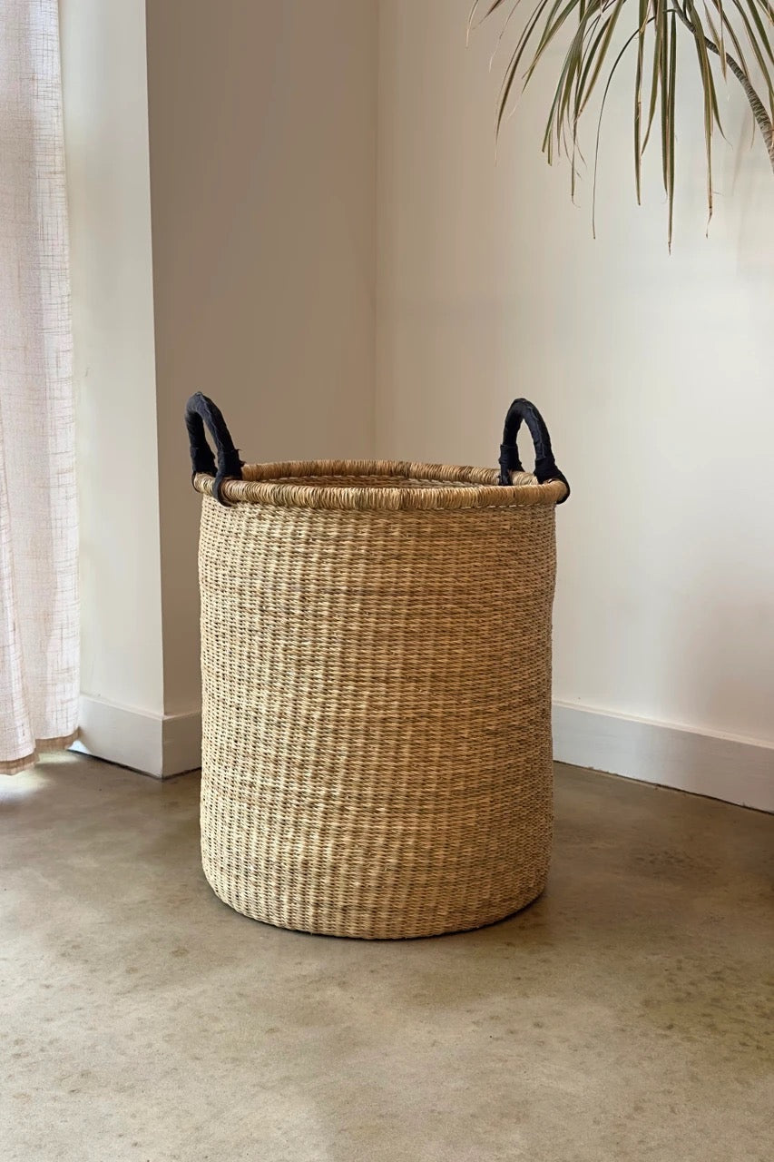 Medium hamper basket with sturdy base and upright shape