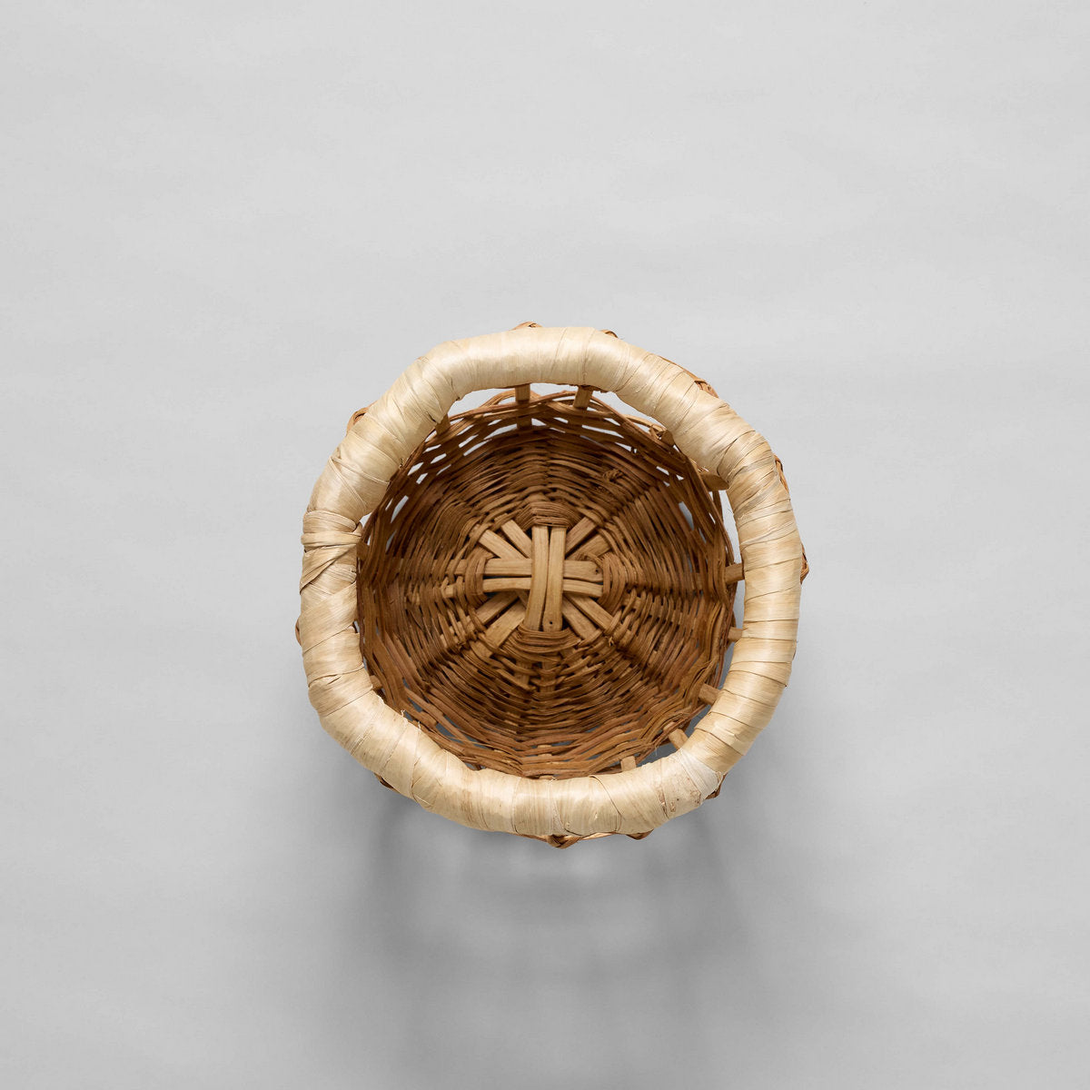 Top view of empty woven basket showcasing detailed rim and base