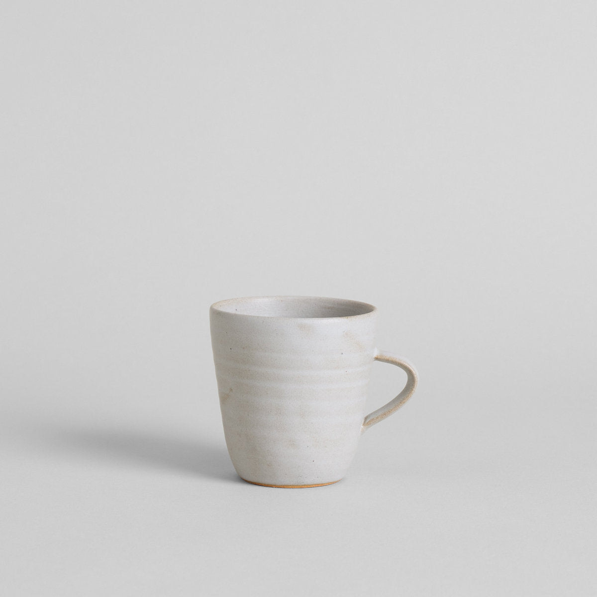 Ceramic coffee mug with subtle variation in tone and texture