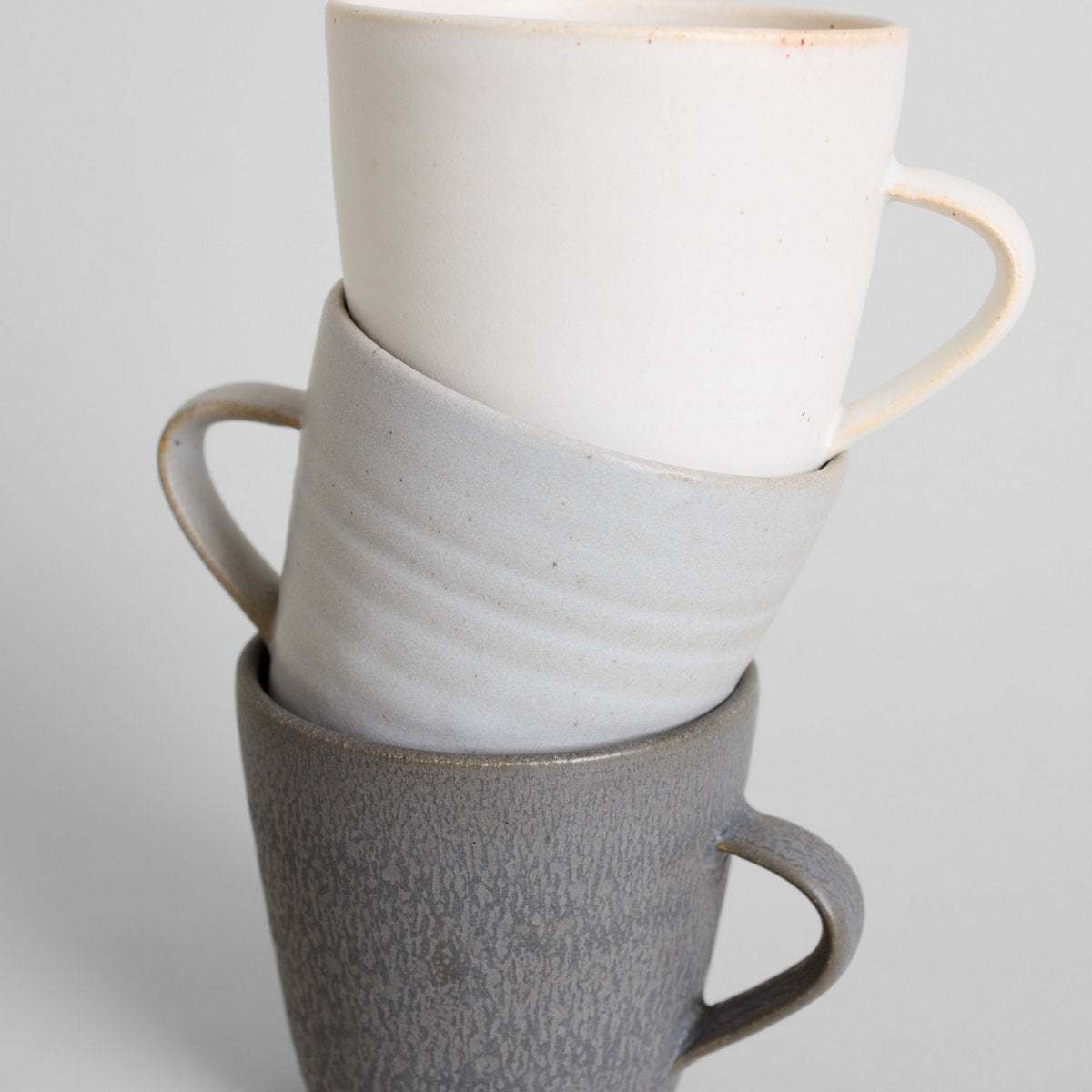 Artisan stoneware coffee mugs with 12 oz capacity