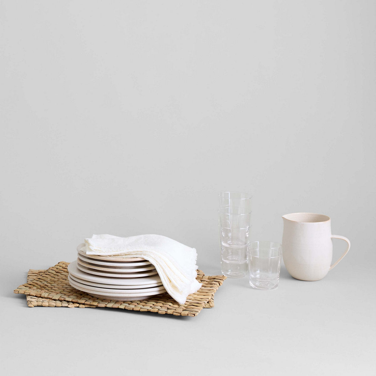 Handmade ceramic pitcher with wide opening for pouring or arranging stems