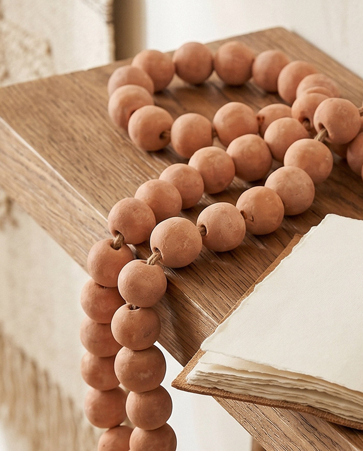 Clay bead garland with individually shaped terracotta beads