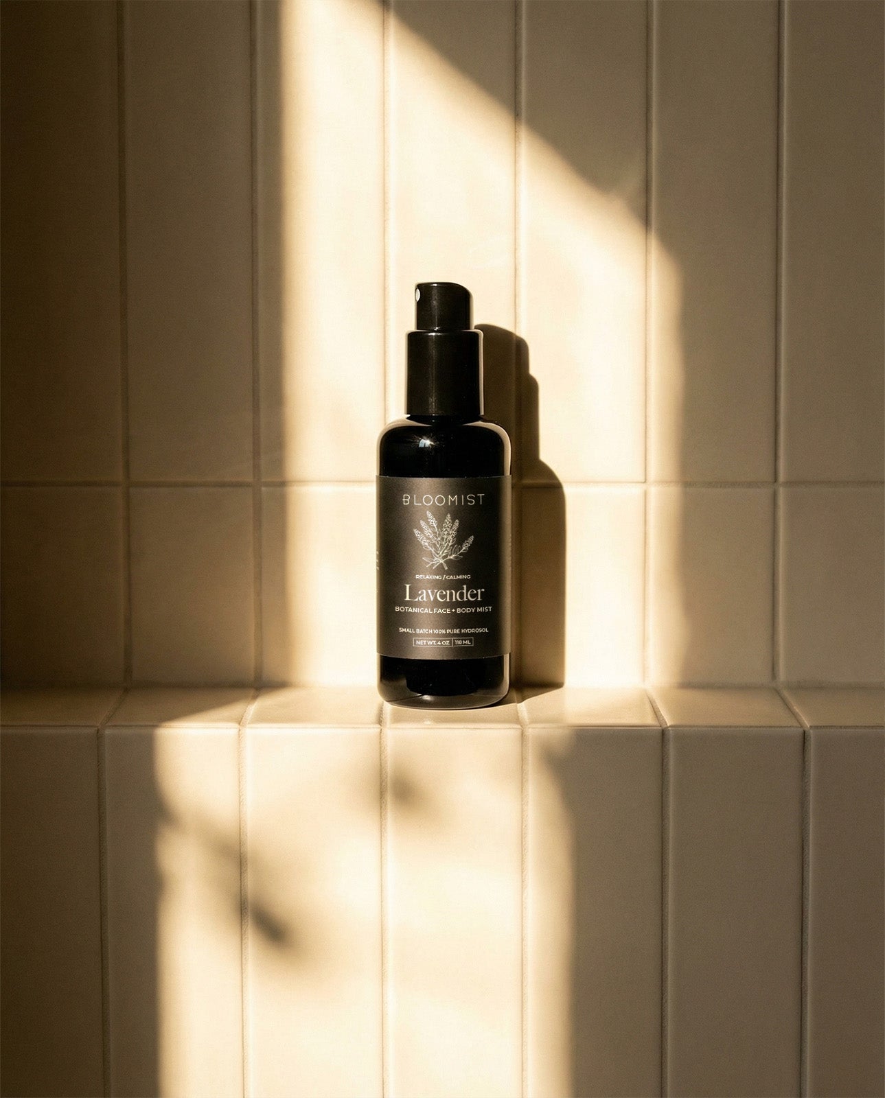 Copper-distilled lavender hydrosol in a black bottle