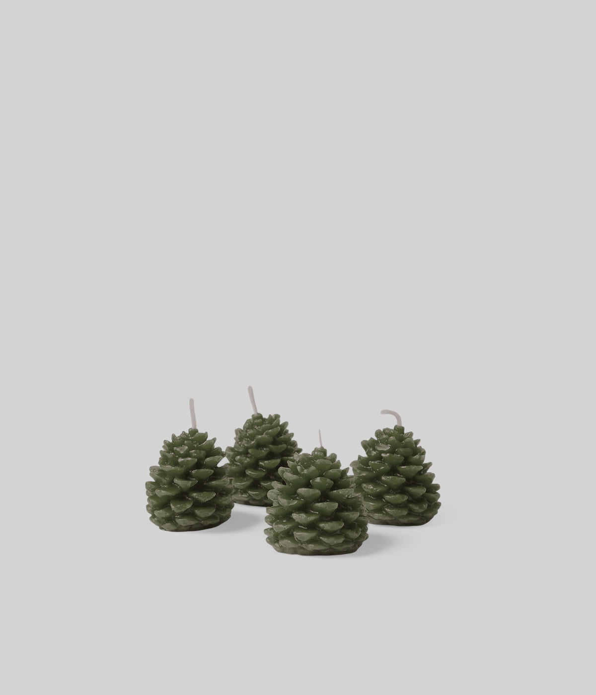 Miniature pine cone candle in antique dark green, beeswax, sculptural detail