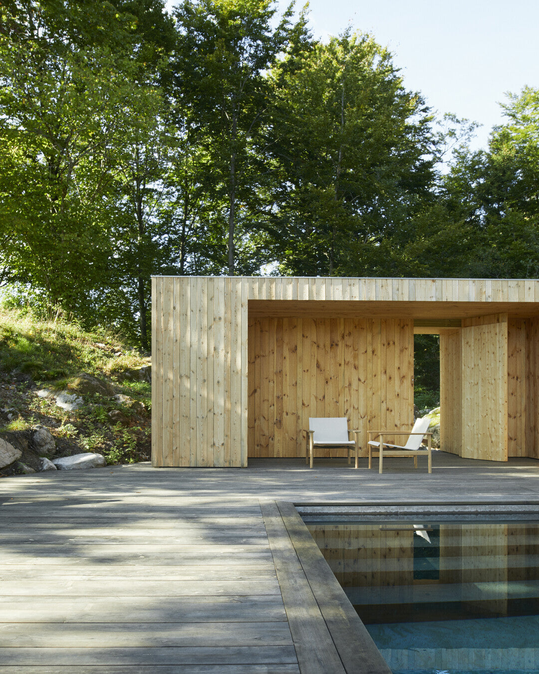 Sleek teak pool lounger
