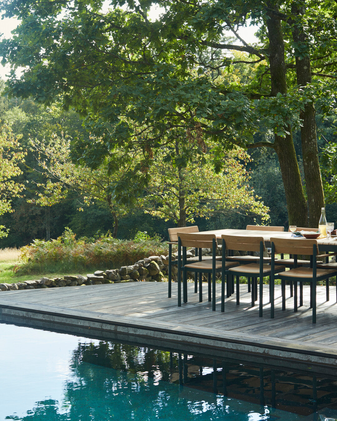 Ergonomic teak patio armchair
