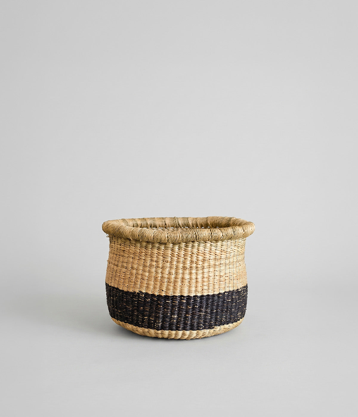 Hadn woven planter basket made from elephant grass with black band