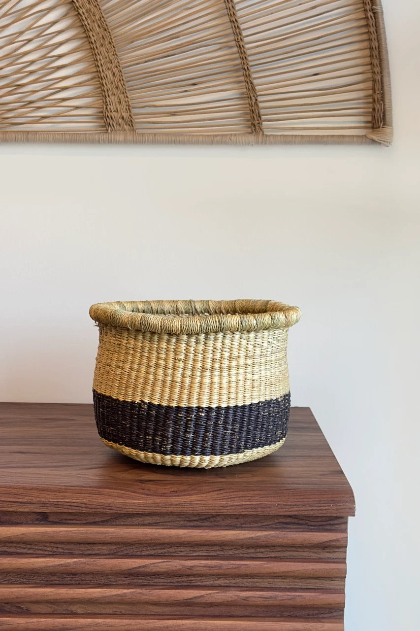 Woven basket for plants from Ghana with coiled rim and natural texture