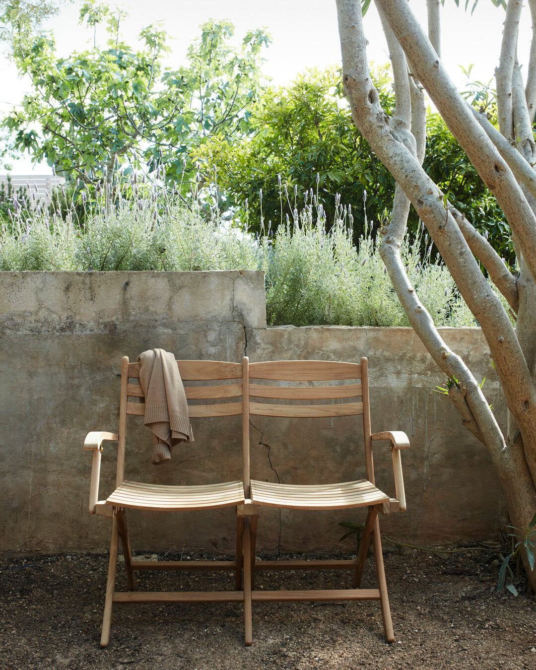 Durable teak bench for gardens
