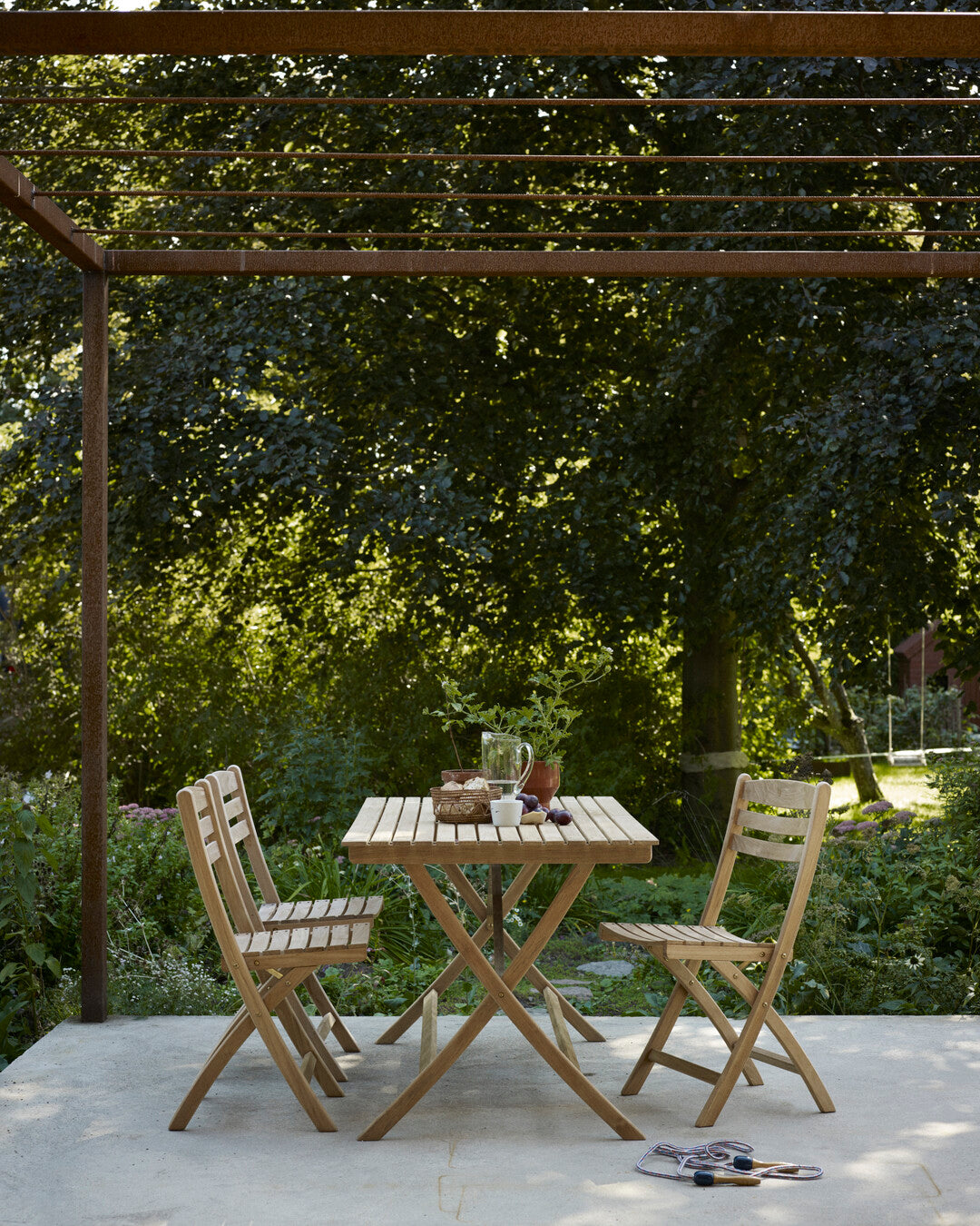 Minimalist Nordic teak outdoor chair
