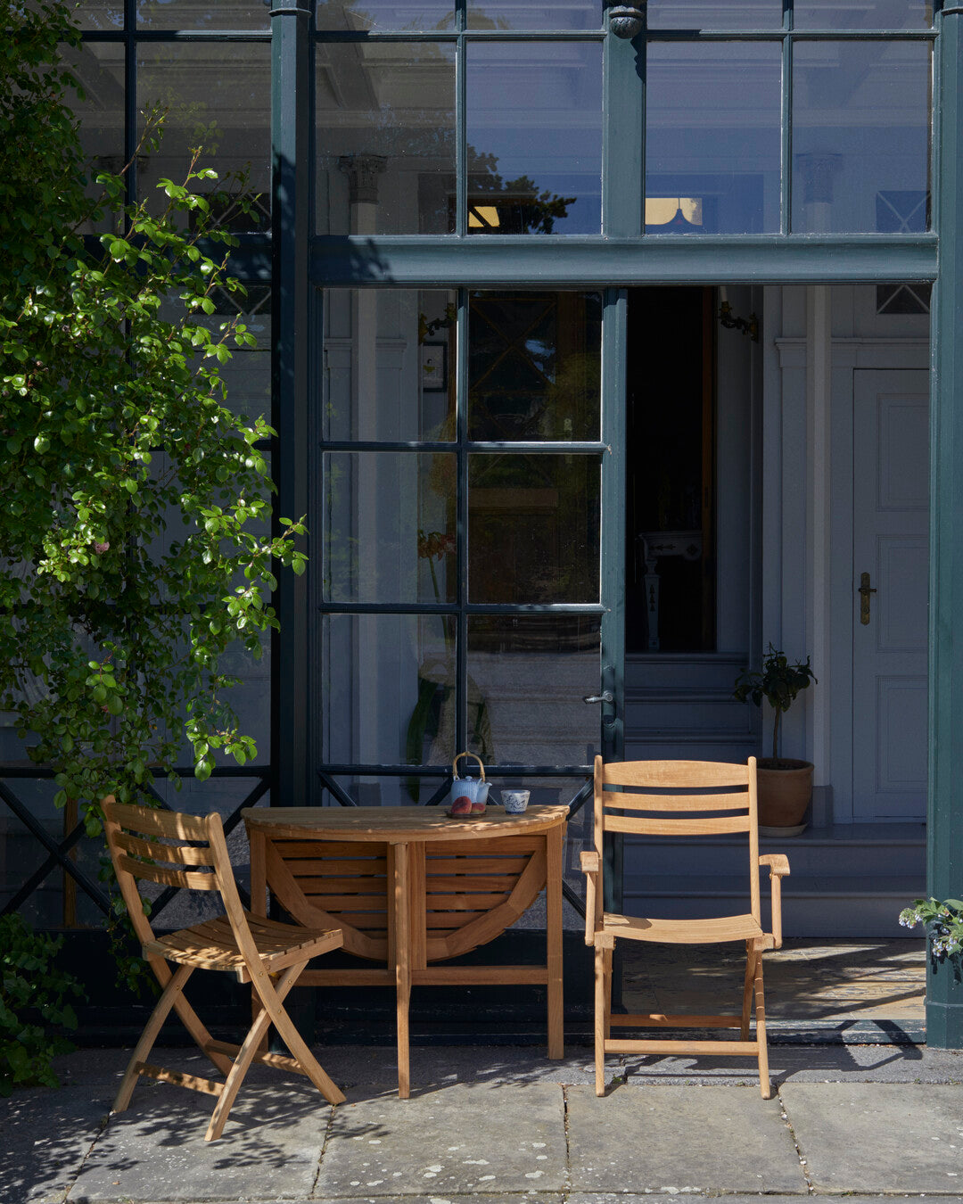 Folding teak chair for patios
