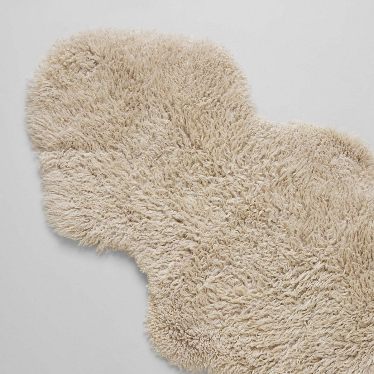 ivory colored long wool curly sheepskin pelt