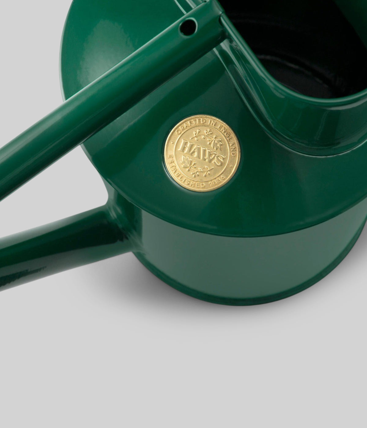 Stylish watering can with timeless green finish and Haws emblem for display and daily use