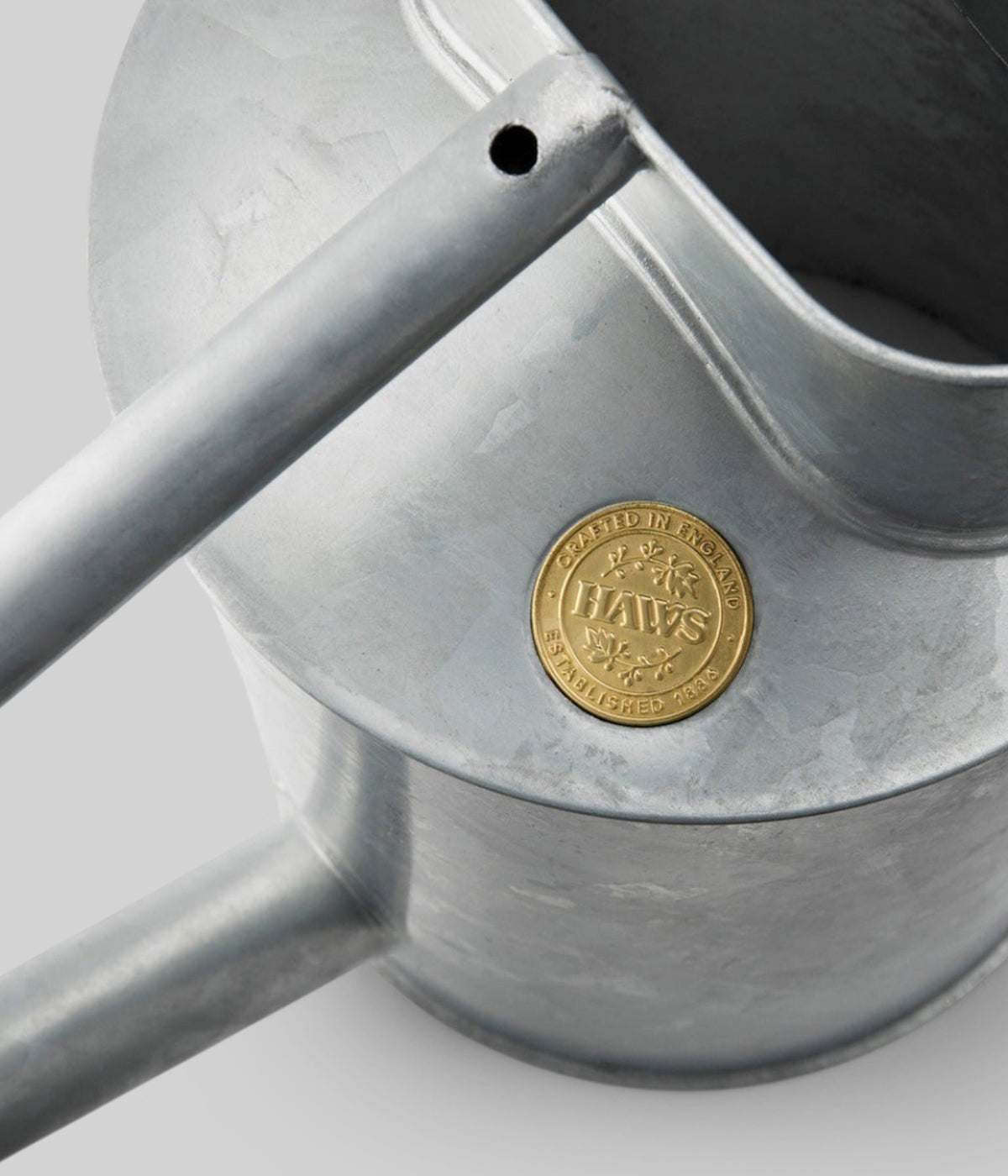 Silver galvanized steel watering can with 2 gallon capacity from Haws