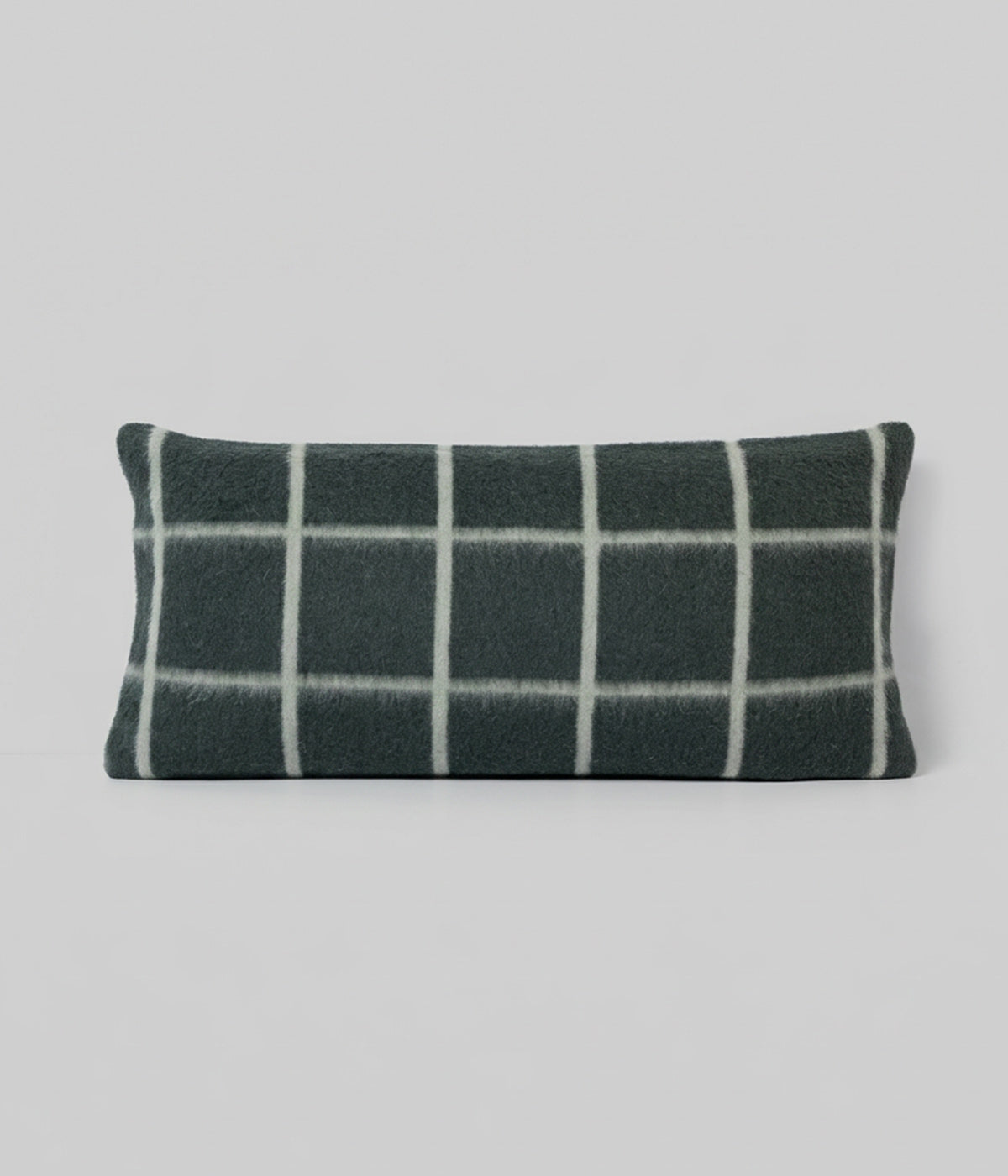 Umi lumbar Darkest Spruce Onsen Grid showing cooler grid on forest ground