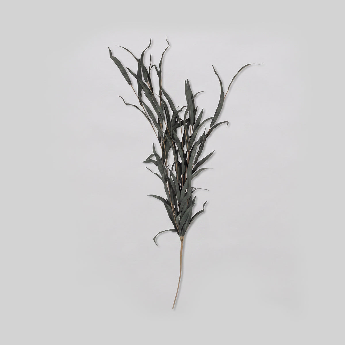 Faux Willow Branch Stem in jade with long, narrow green fabric leaves.