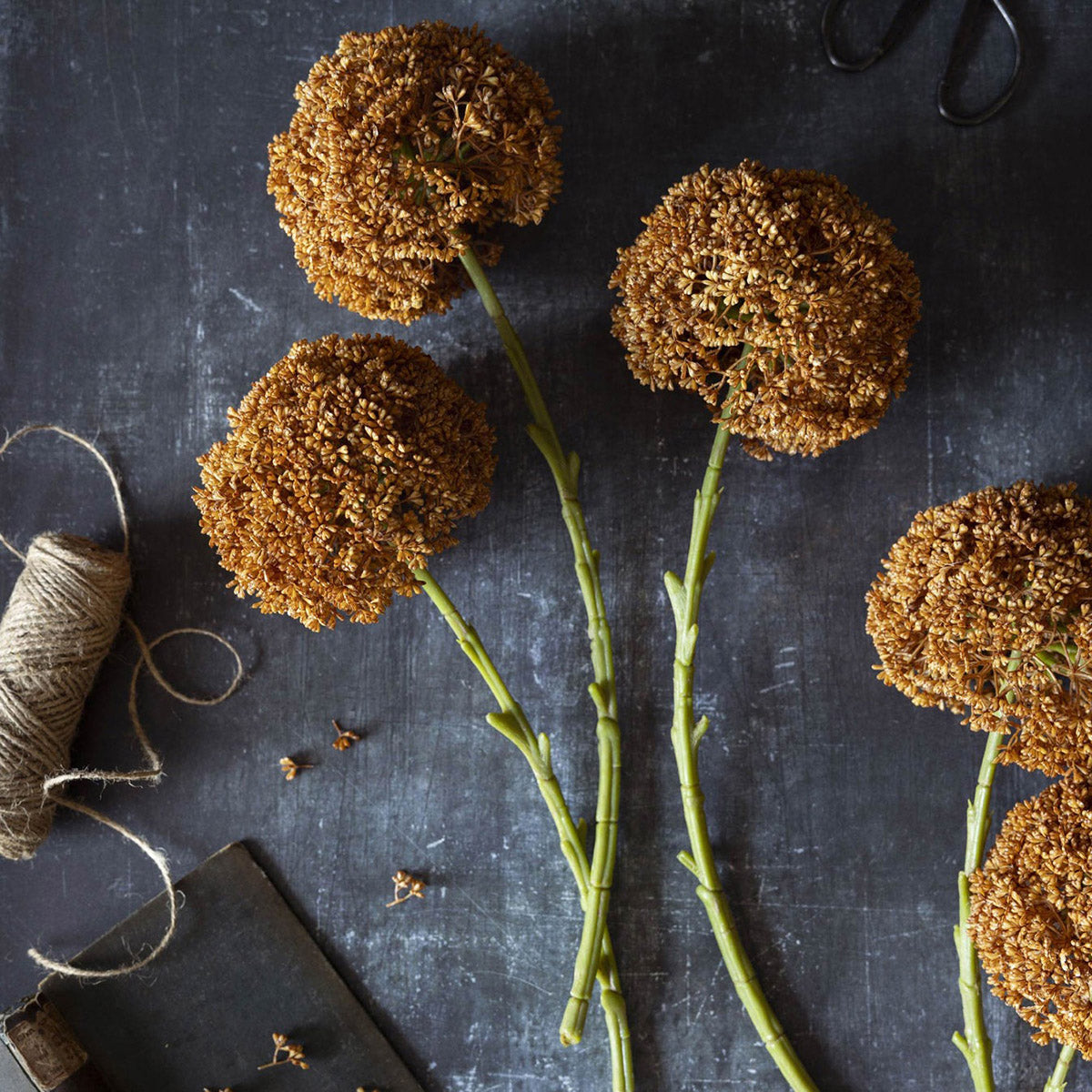 Moody umber faux allium flower with refined texture and natural proportions