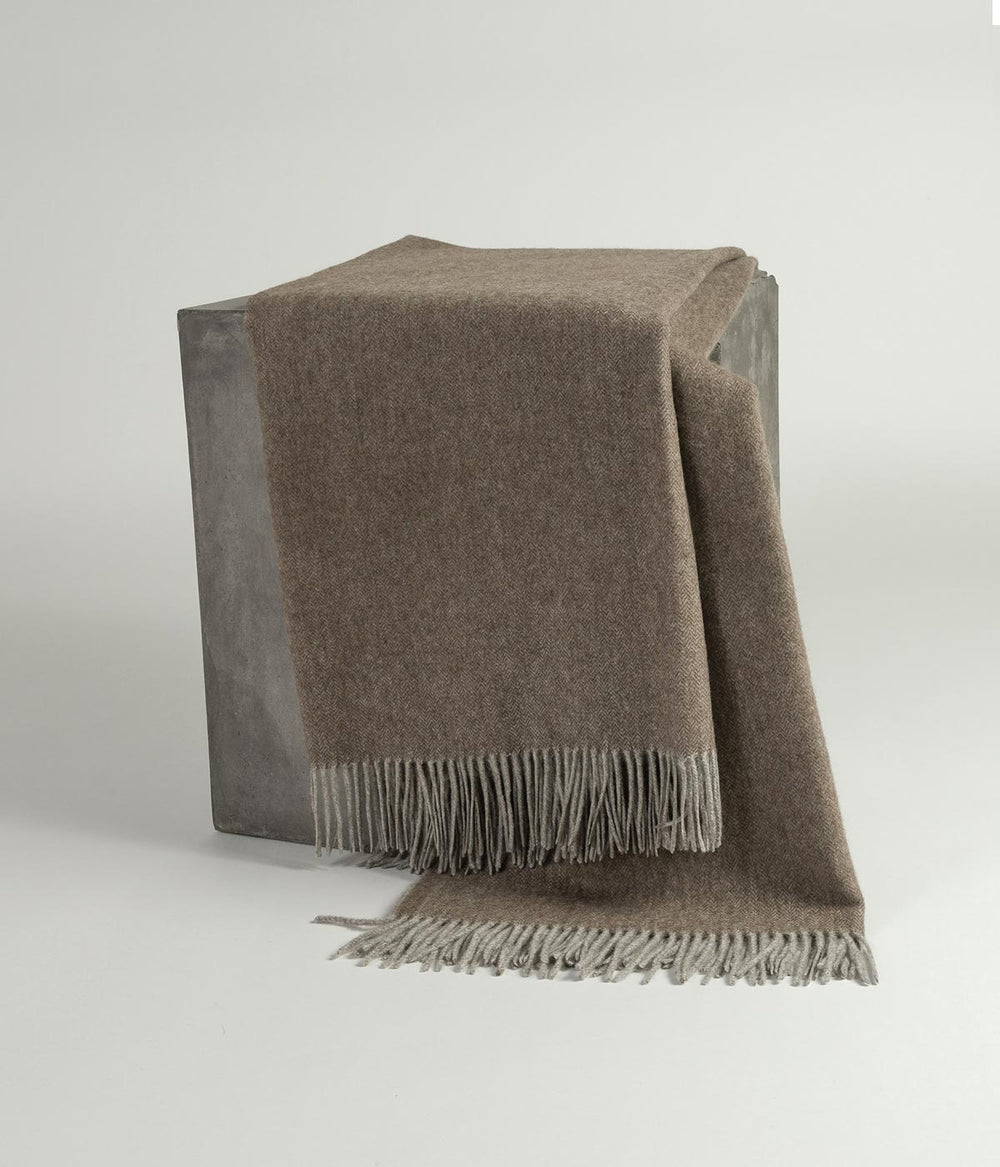 Luxurious herringbone blanket made from sustainable yak down in cappuccino with platinum accents