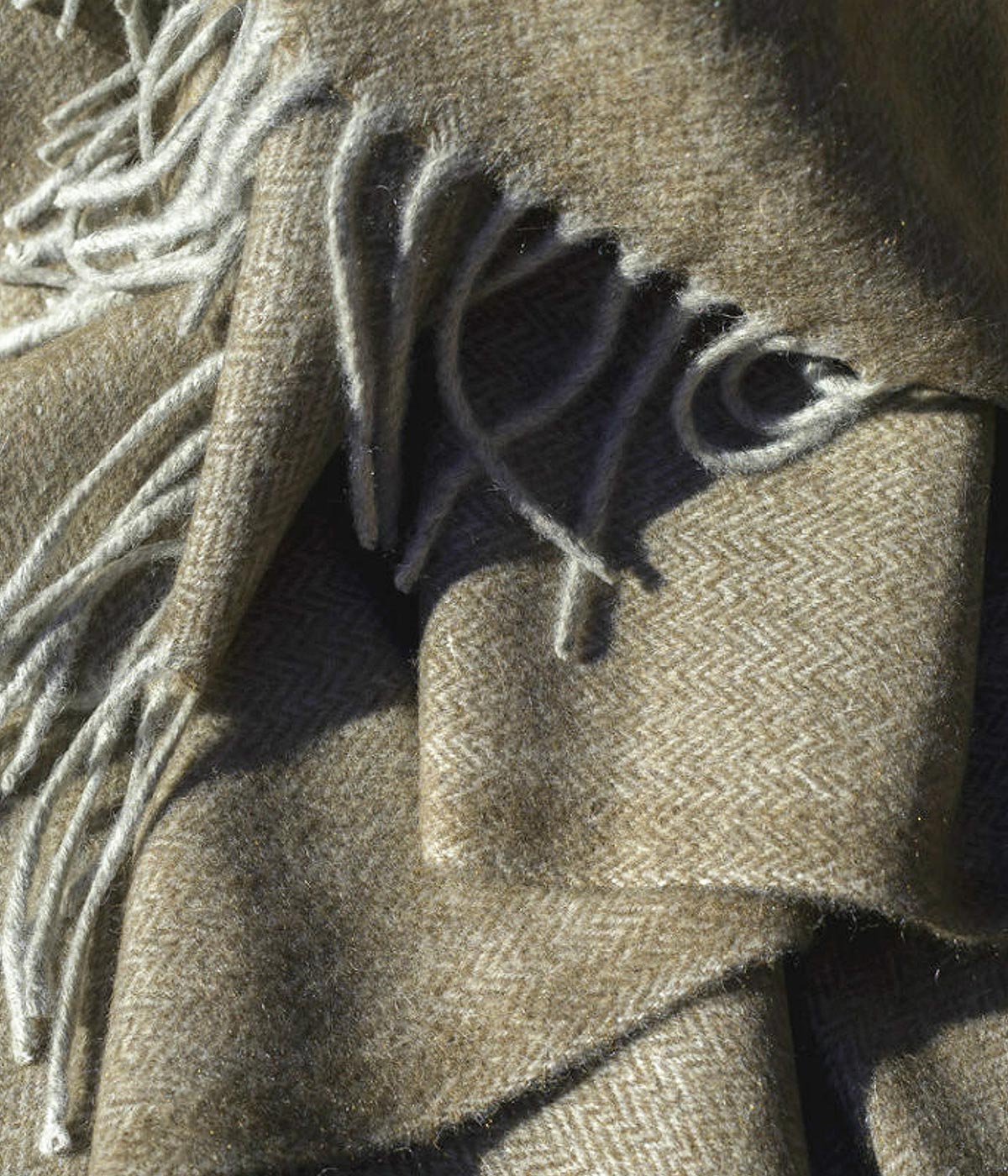 Sustainable and hypoallergenic yak down throw perfect as a cozy wrap or elegant decorative piece