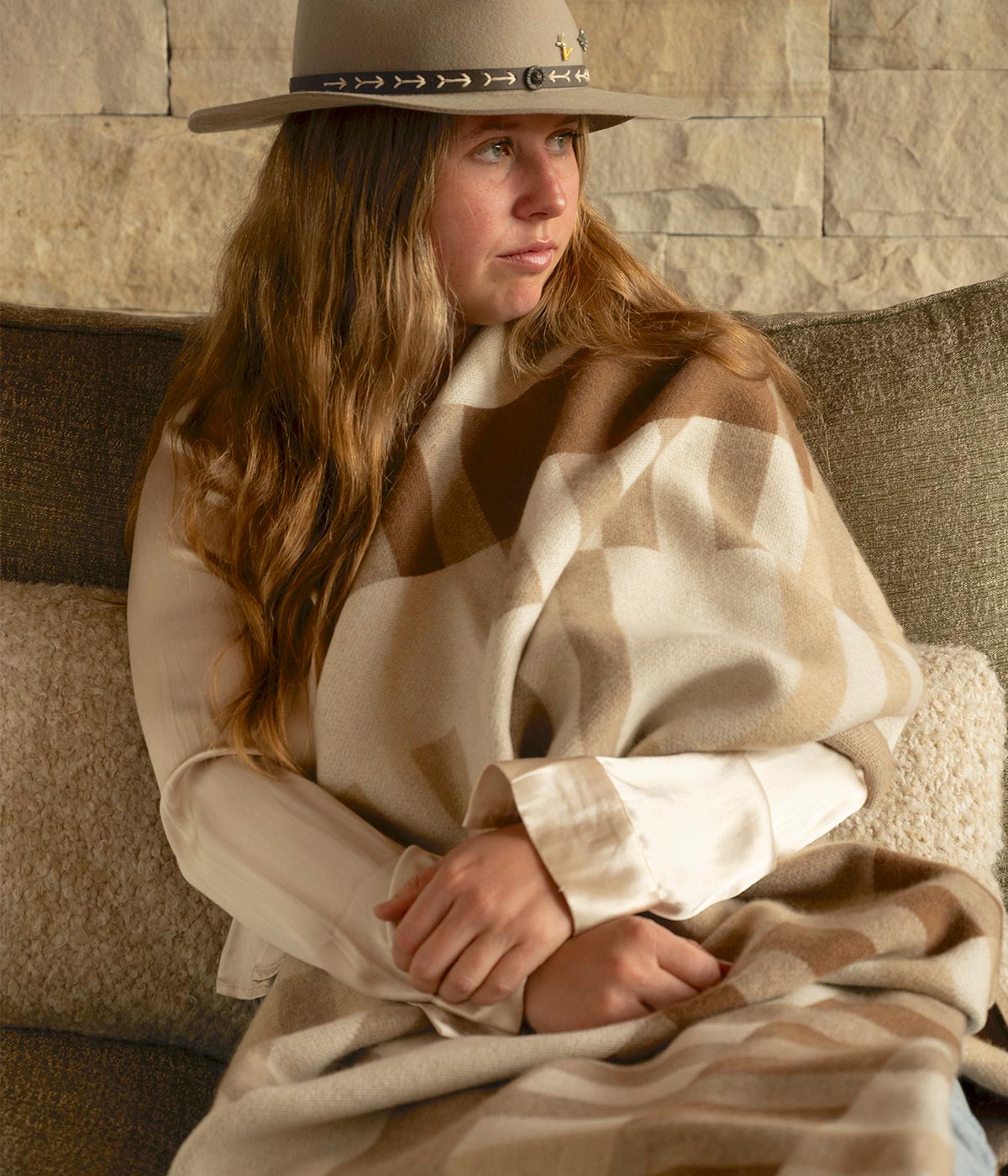 Soft knit Bauhaus blanket in warm natural tones made from sustainable cashmere