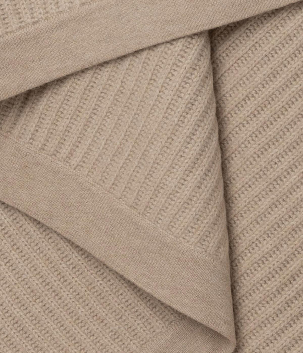Ultra-soft Beige Cashmere Throw with fisherman’s knit for added texture and warmth