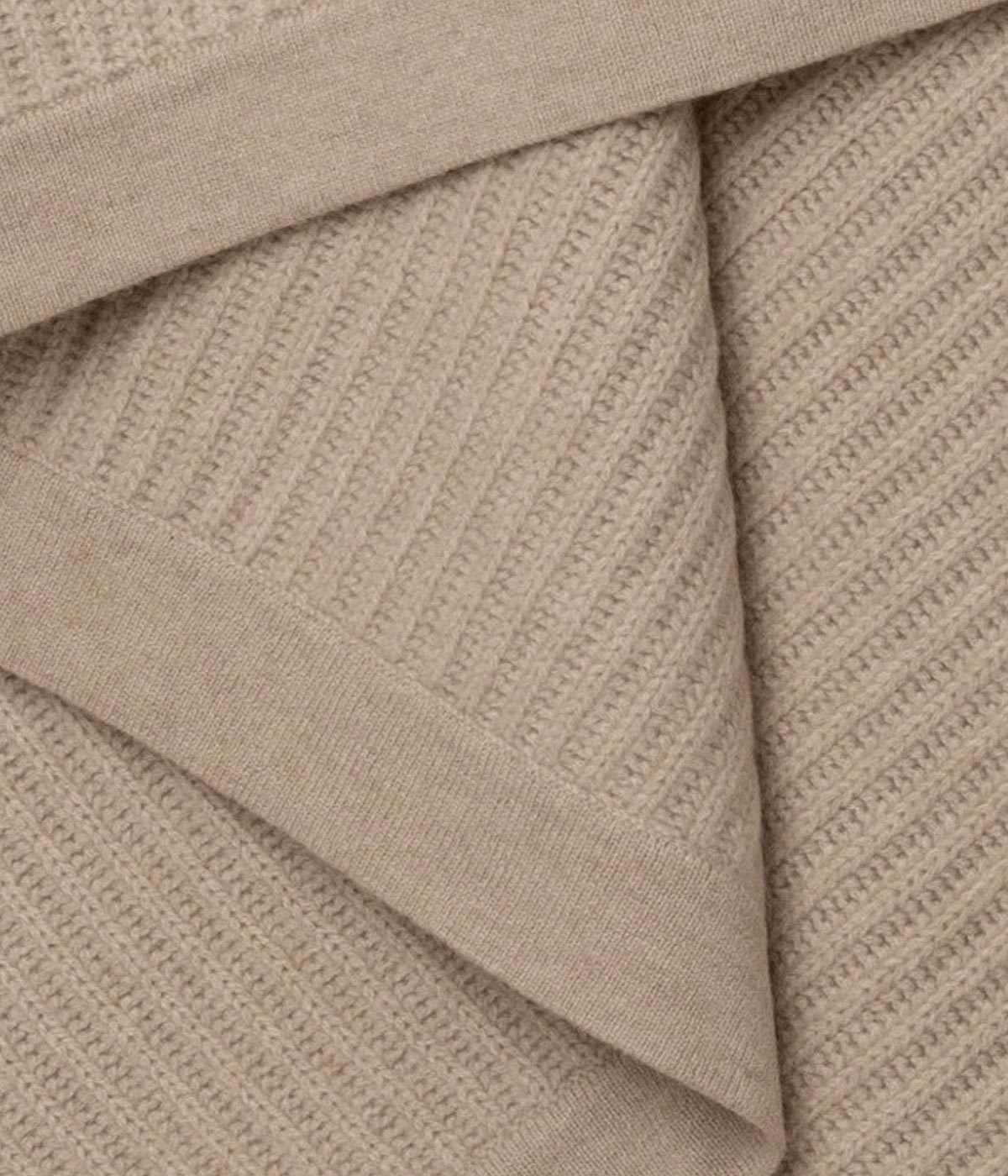 Ultra-soft Beige Cashmere Throw with fisherman’s knit for added texture and warmth