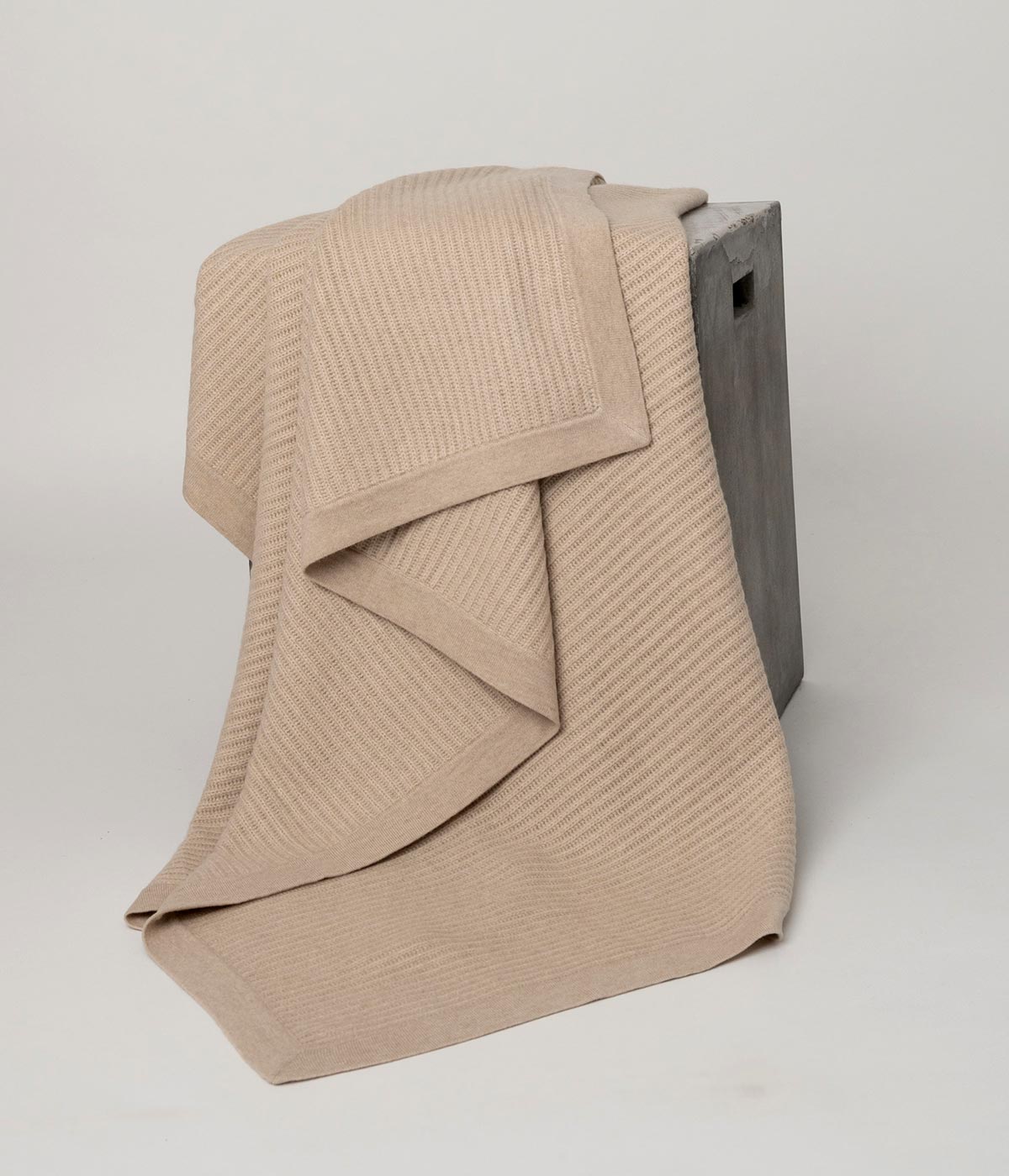 Handwoven Beige Cashmere Knit Throw, offering breathable warmth and artisanal craftsmanship