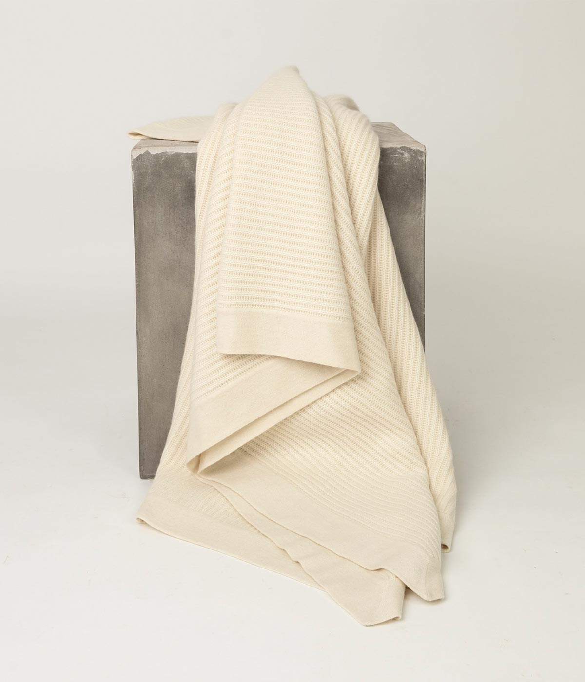 Cream Cashmere Throw with fisherman’s knit, a perfect blend of texture and softness